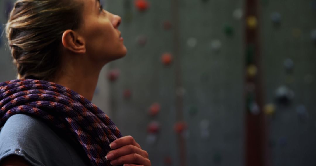 Caucasian Woman Preparing for Indoor Rock Climbing Adventure - Free Images, Stock Photos and Pictures on Pikwizard.com