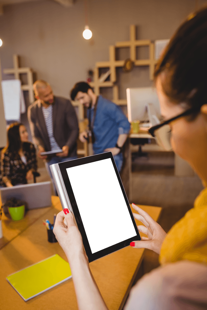 Graphic Designers Collaborating in Modern Office with Digital Tablet