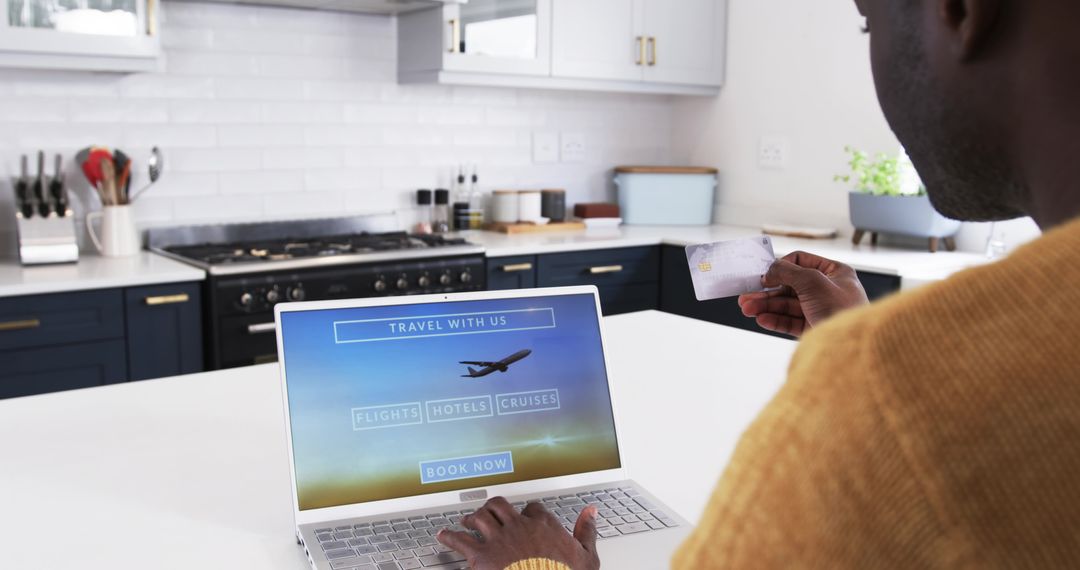 Man Planning Trip Online from Comfortable Kitchen