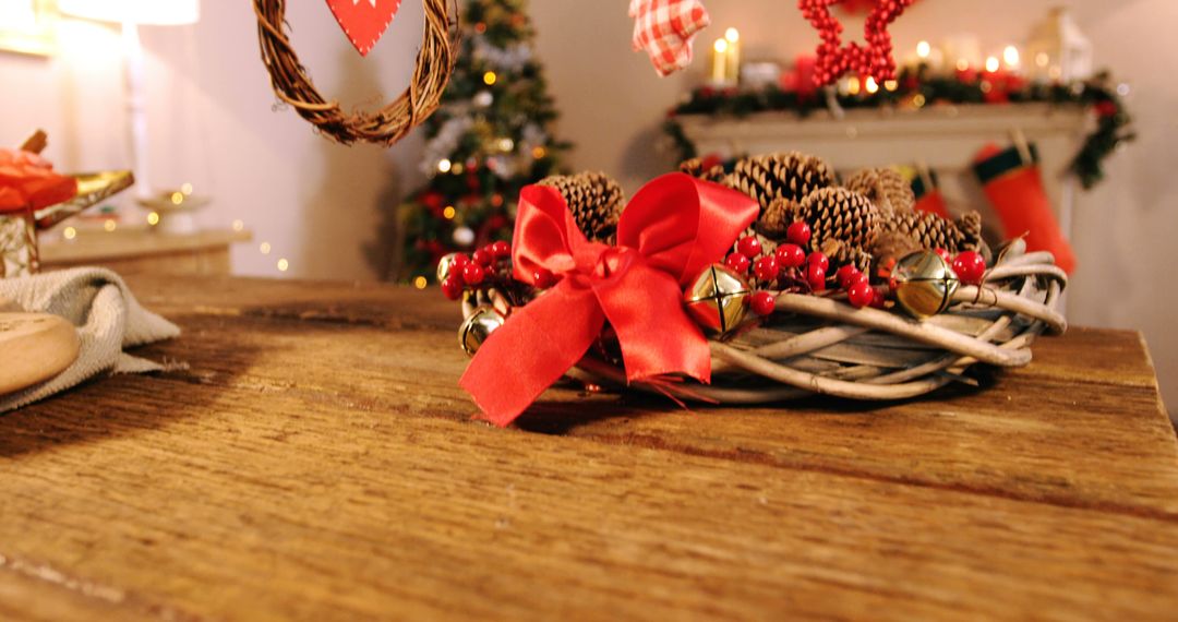 Grapevine wreath with red ribbon and pine cone on wooden table during christmas time 4k - Free Images, Stock Photos and Pictures on Pikwizard.com