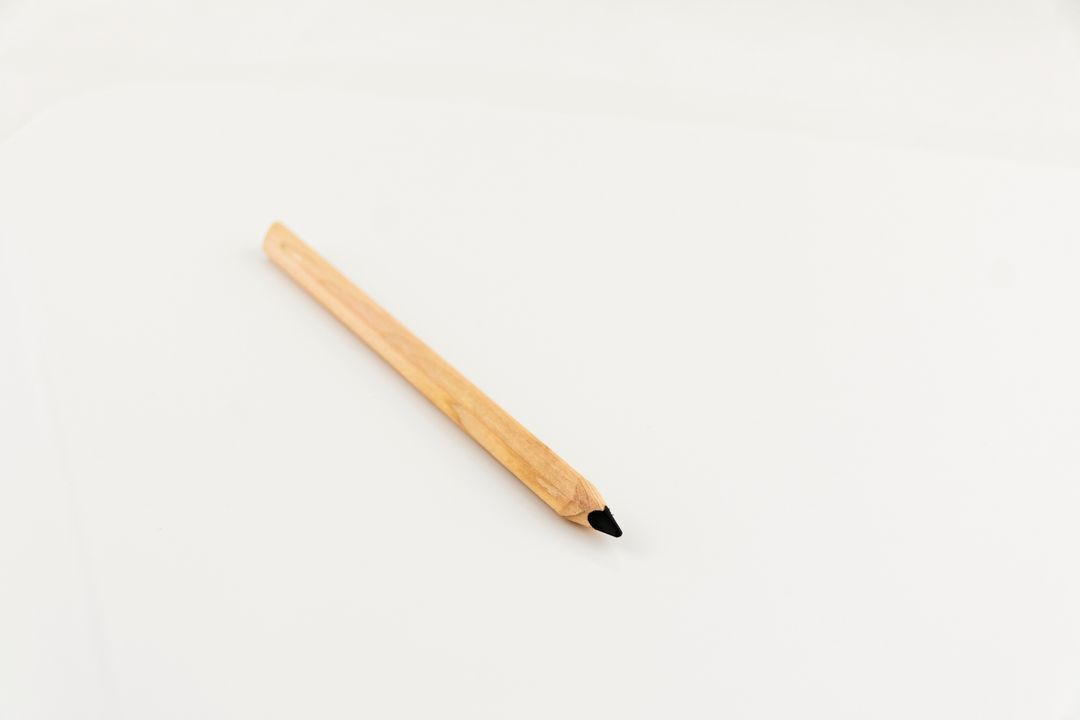 Minimalistic Wooden Pencil on White Background - Free Images, Stock Photos and Pictures on Pikwizard.com