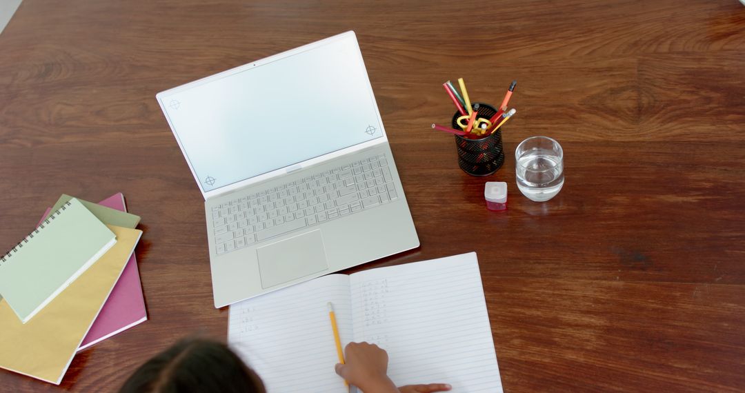 Overhead View Girl Learning Remote with Books and Laptop