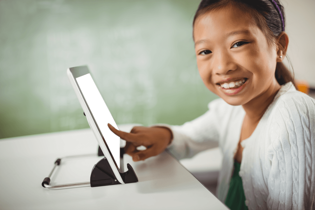smiling girl using tablet with transparent screen for learning - Download Free Stock Images Pikwizard.com