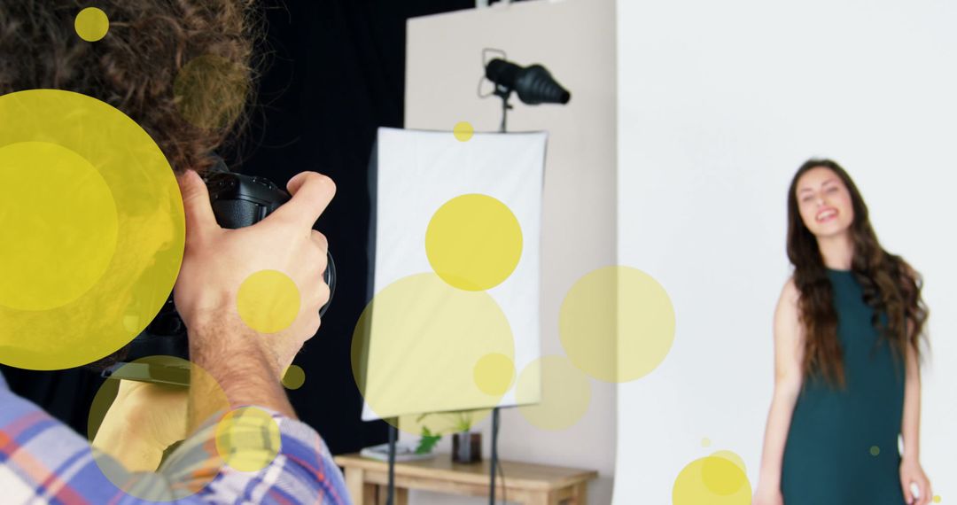 Photographer Capturing Happy Model in Studio Session with Overlay Effects