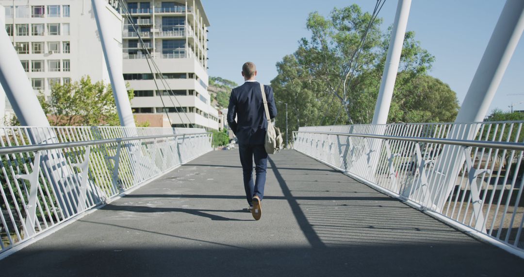 Businessman Walking on Bridge with Cityscape Background - Free Images, Stock Photos and Pictures on Pikwizard.com