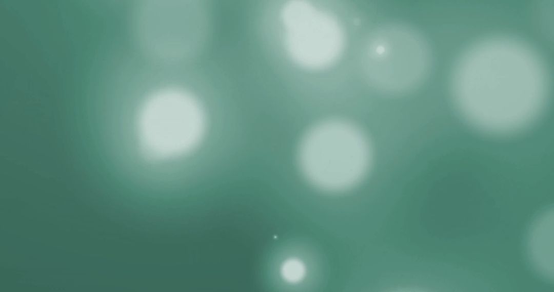 Abstract Green Background with Glowing Bokeh Lights