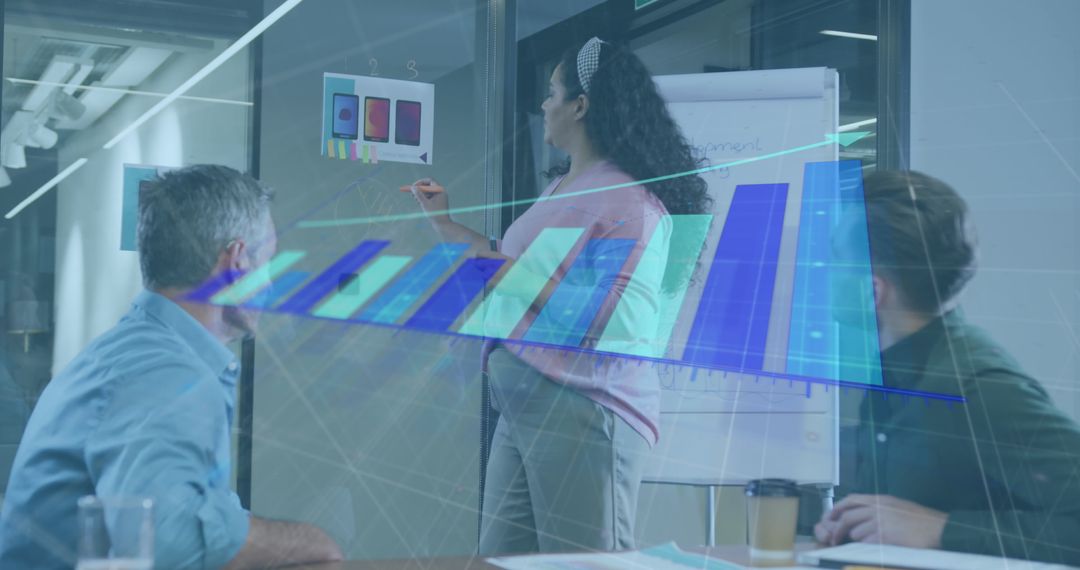 Business Team Analyzing Financial Graph in Modern Office