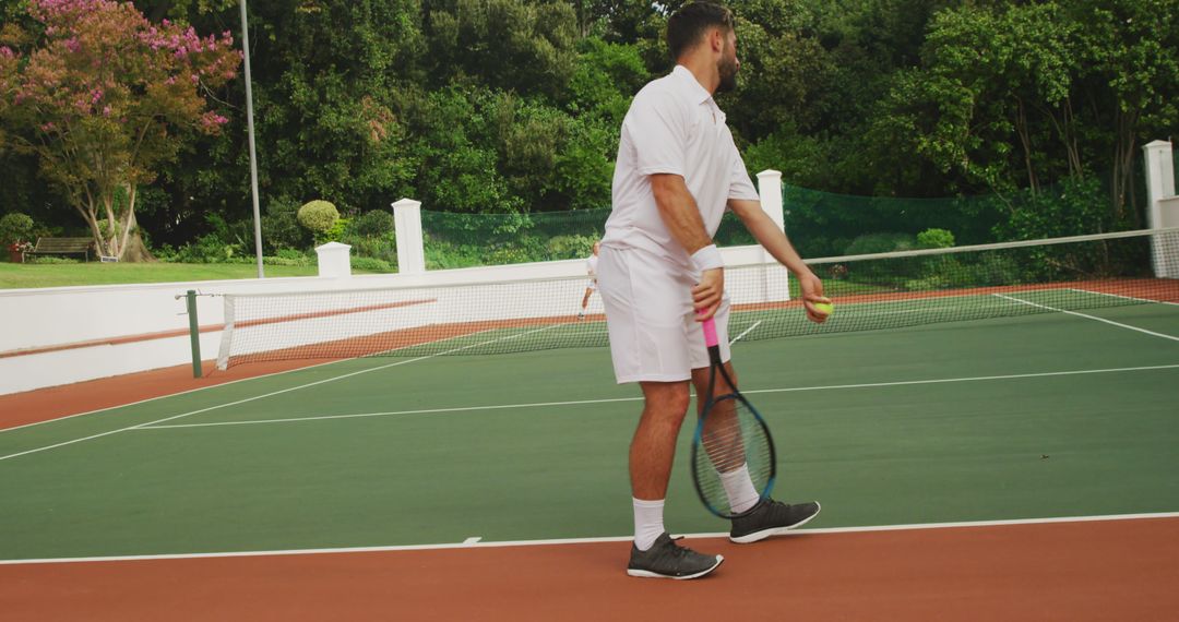 Man Preparing to Serve on Tennis Court Outdoors - Free Images, Stock Photos and Pictures on Pikwizard.com