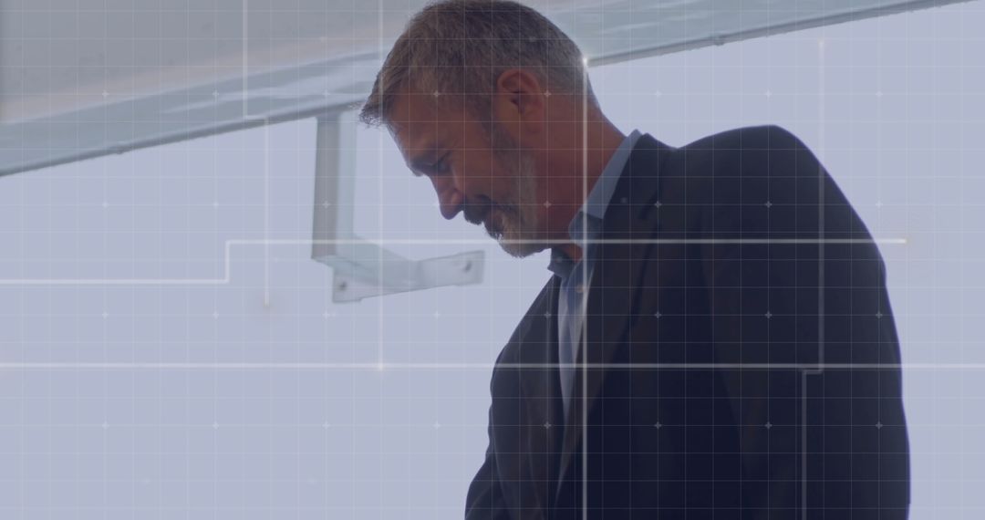 Business Executive Analyzing Data with Digital Overlay Grid