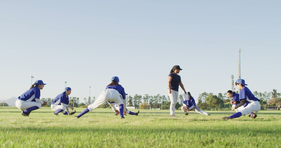 Baseball Coach and Team Stretching On Field - Free Images, Stock Photos and Pictures on Pikwizard.com