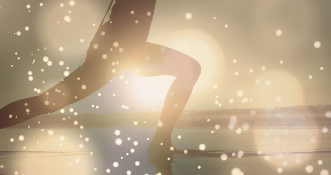 Silhouette of Person in Yoga Pose with Light Spots