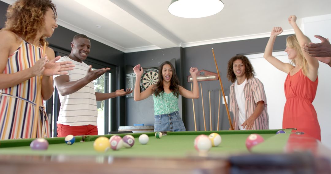 Diverse Group of Friends Enjoying Billiards Game Together