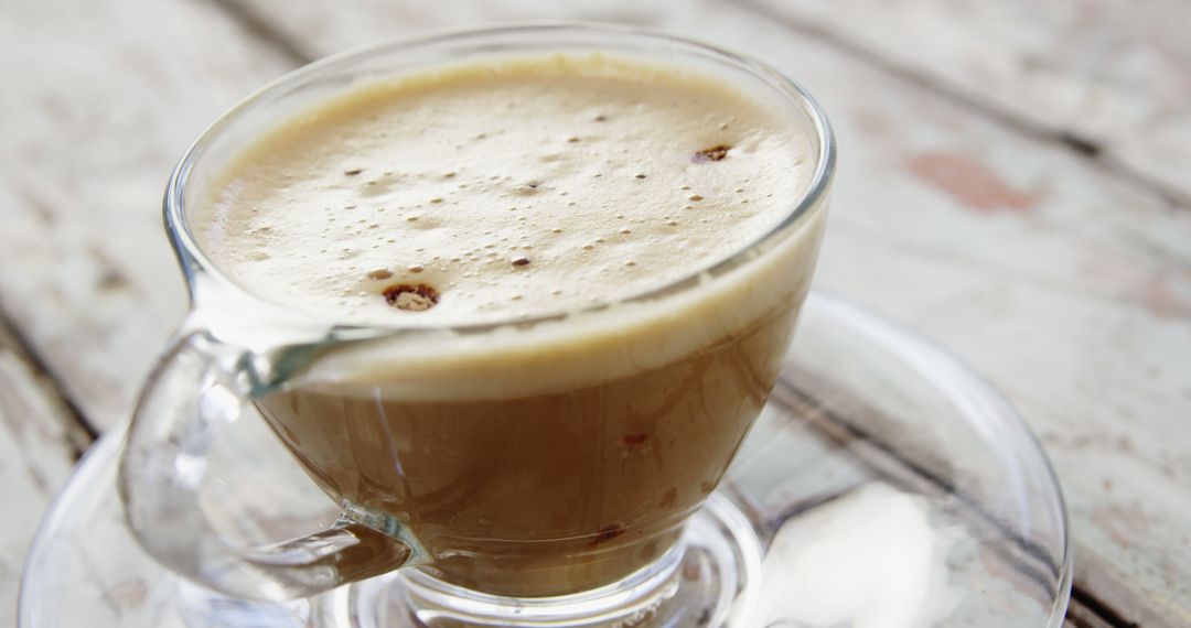 Hot Cappuccino in Glass Cup on Wooden Table - Free Images, Stock Photos and Pictures on Pikwizard.com