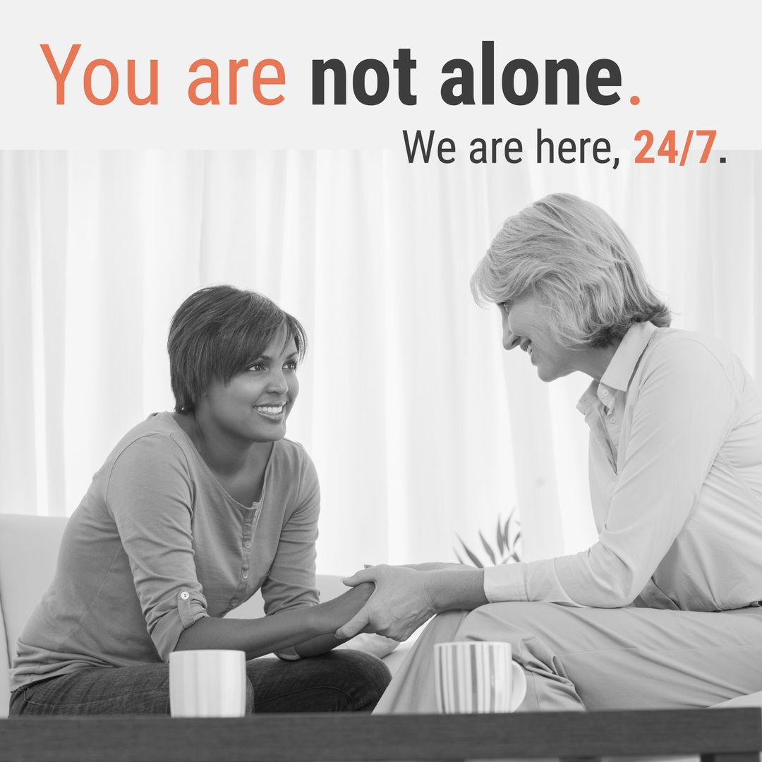 Supportive Counselor Holding Hands with Client for Emotional Comfort