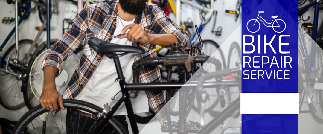Skilled Bicycle Mechanic Repairing Cycle in Shop