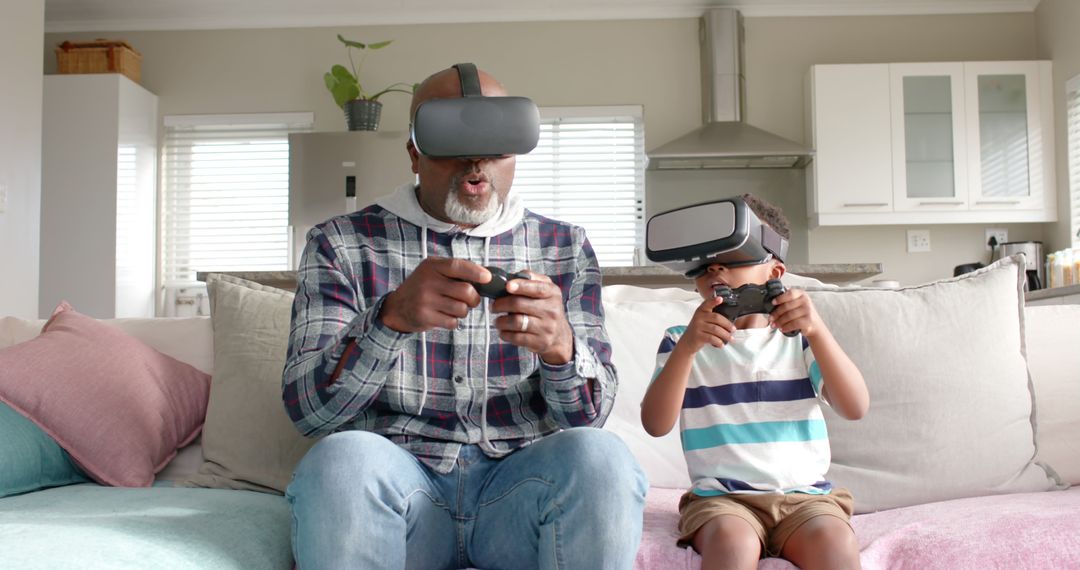 Grandfather and Grandson Using VR Headsets and Gaming Controllers in Living Room - Free Images, Stock Photos and Pictures on Pikwizard.com