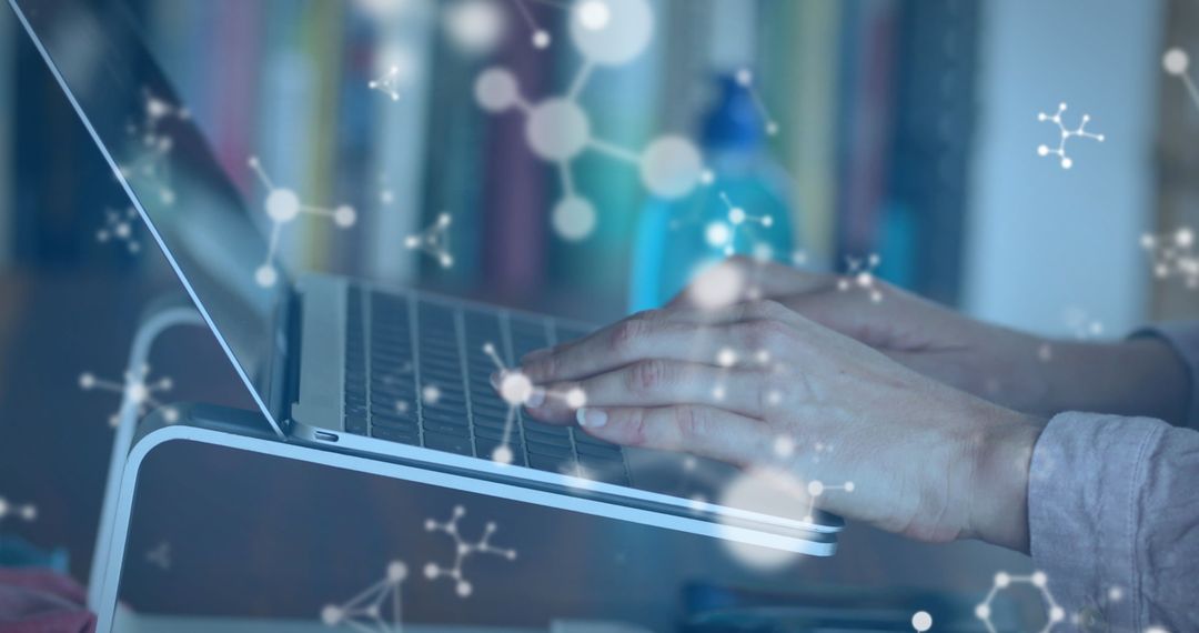 Hands Typing on Laptop with Futuristic Overlay