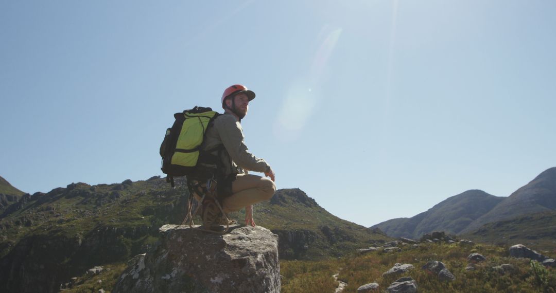 Hiker with Backpack Surveying Mountain Landscape Under Clear Sky - Free Images, Stock Photos and Pictures on Pikwizard.com