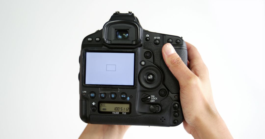 Person Holding Professional DSLR Camera - Free Images, Stock Photos and Pictures on Pikwizard.com