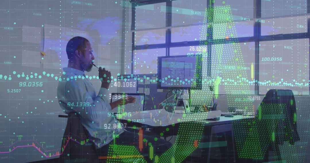 Businessman Analyzing Data on Computer with Digital Interface Overlay