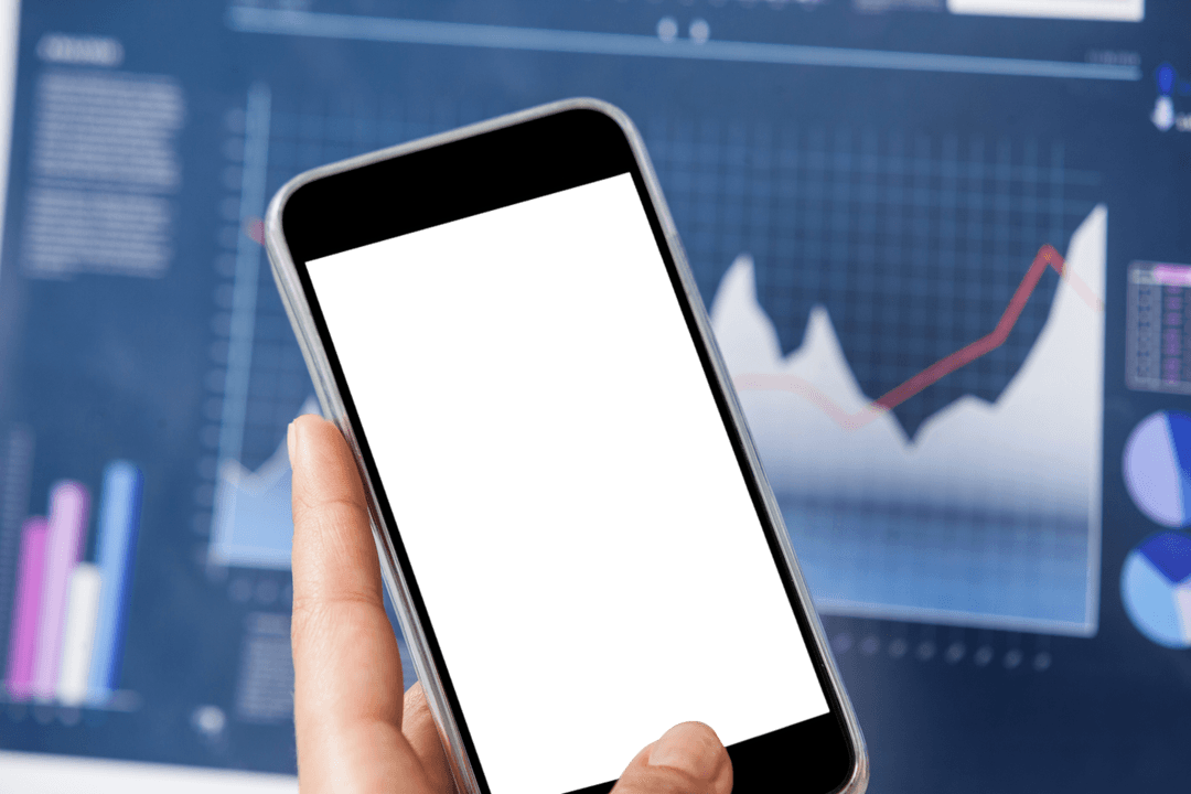 Hand Holding Transparent Mobile Phone with Business Graph in Background