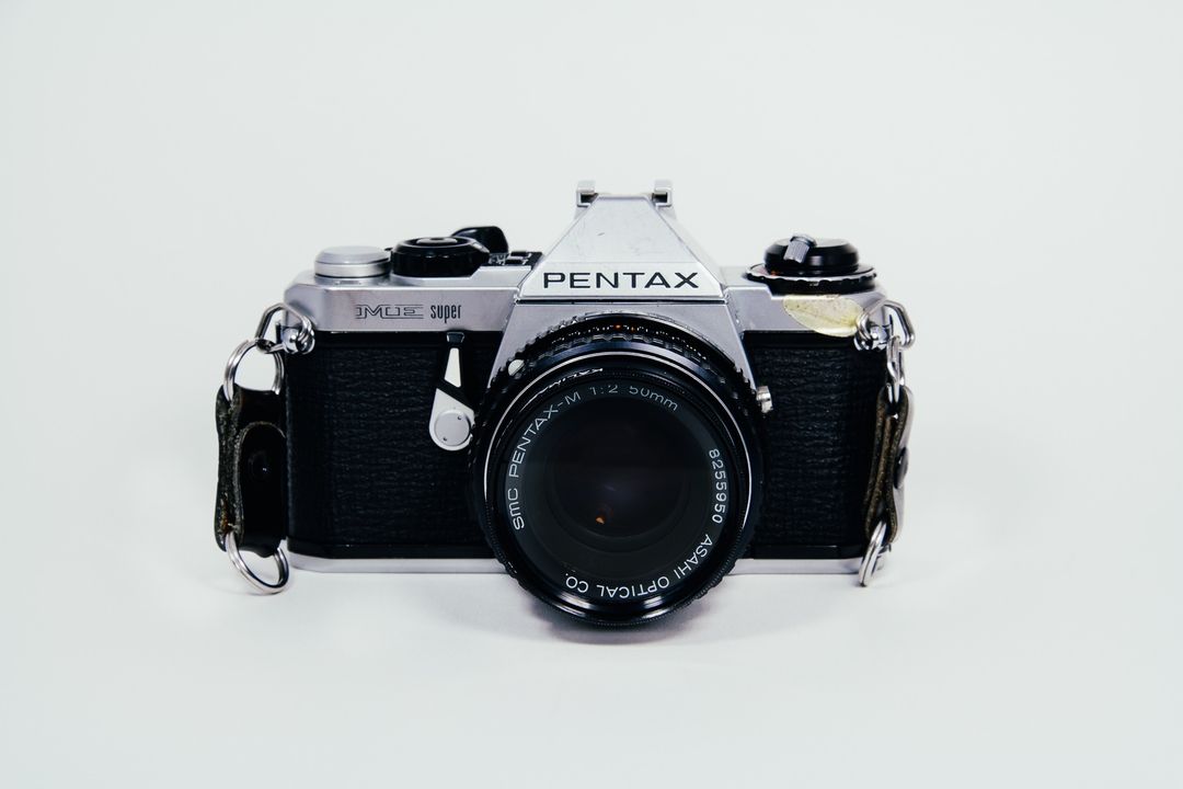 Vintage Pentax Camera On Plain Background - Free Images, Stock Photos and Pictures on Pikwizard.com