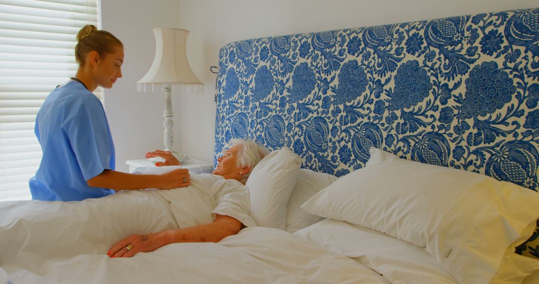 Nurse Caring for Elderly Patient in Comfortable Bedroom - Free Images, Stock Photos and Pictures on Pikwizard.com