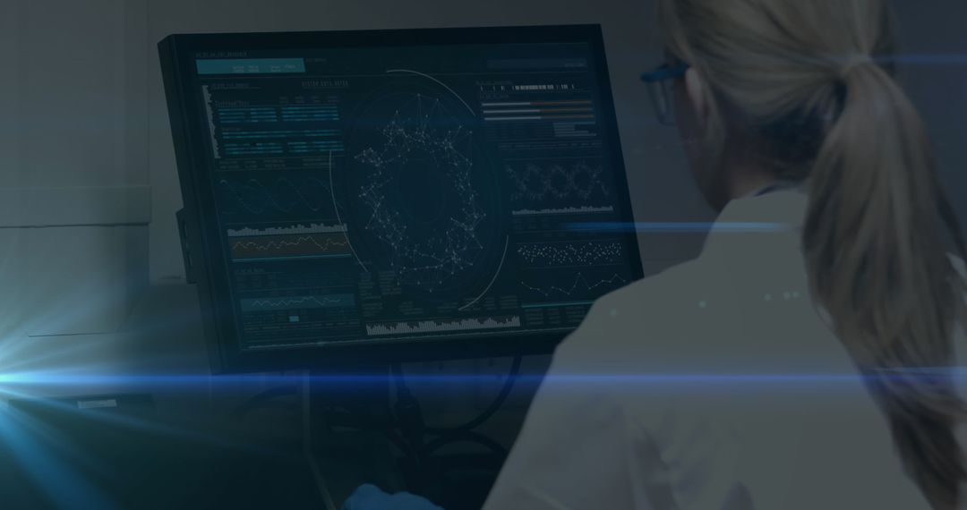 Female Scientist Analyzing Biological Data on Computer Screen