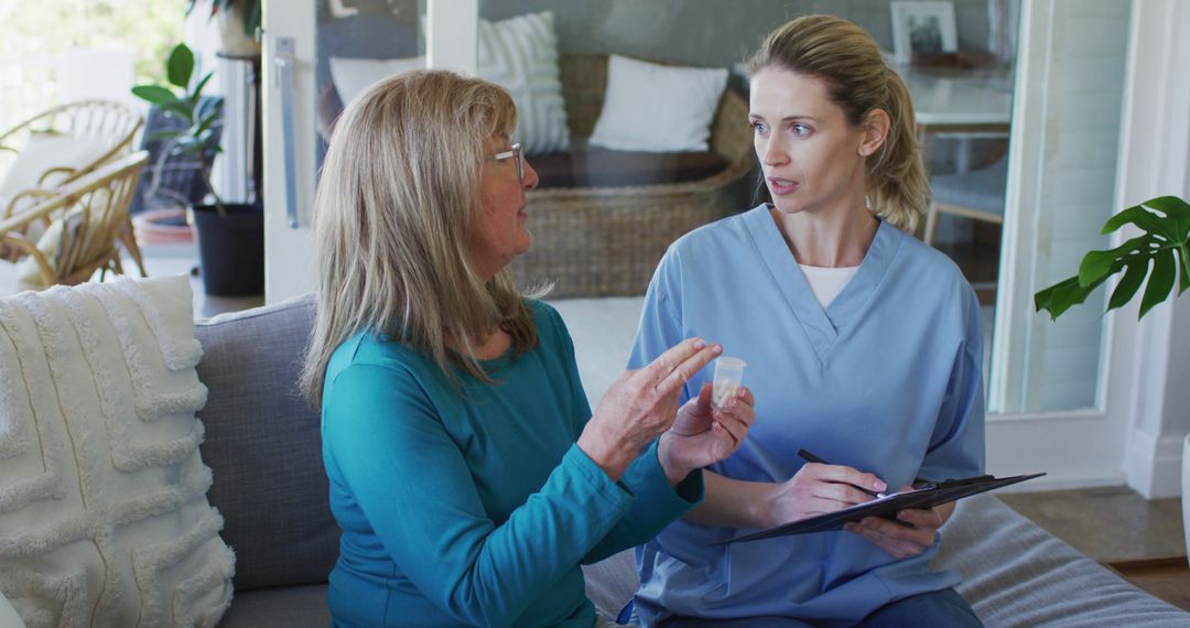 Home Health Nurse Discussing Medication with Elderly Woman - Free Images, Stock Photos and Pictures on Pikwizard.com