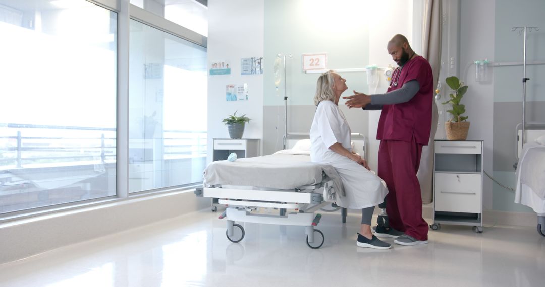 Nurse Comforting Elderly Patient in Modern Hospital Room - Free Images, Stock Photos and Pictures on Pikwizard.com