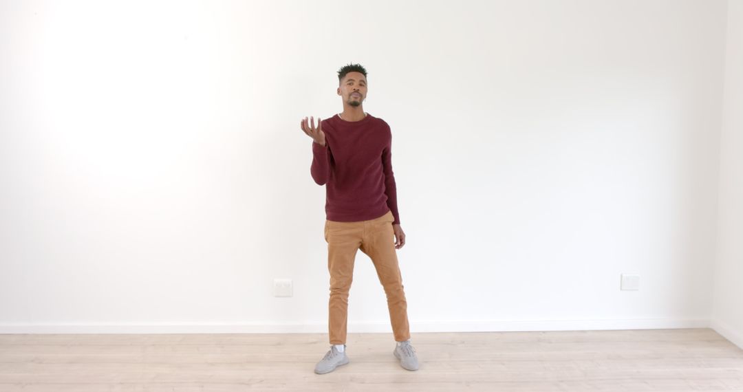 Man Expressing Creativity with Dance in Minimalist Setting