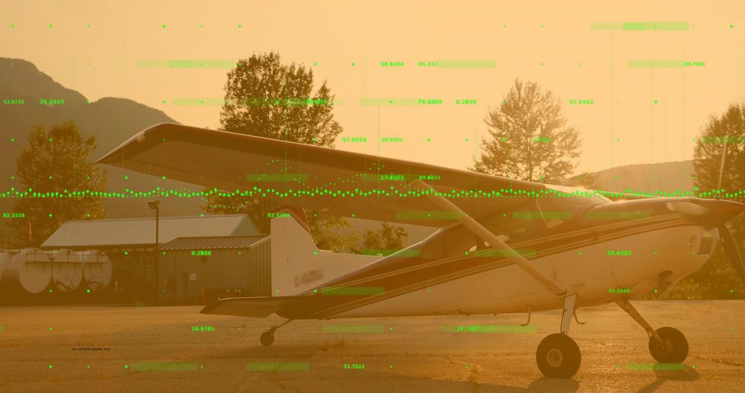 Single-Engine Propeller Plane Sitting on Apron at Sunset with Green Digital Data Overlay