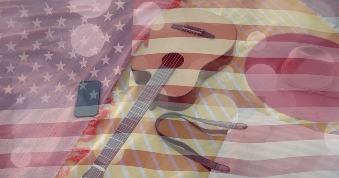 Guitar and Smartphone on Beach Towel with American Flag Overlay