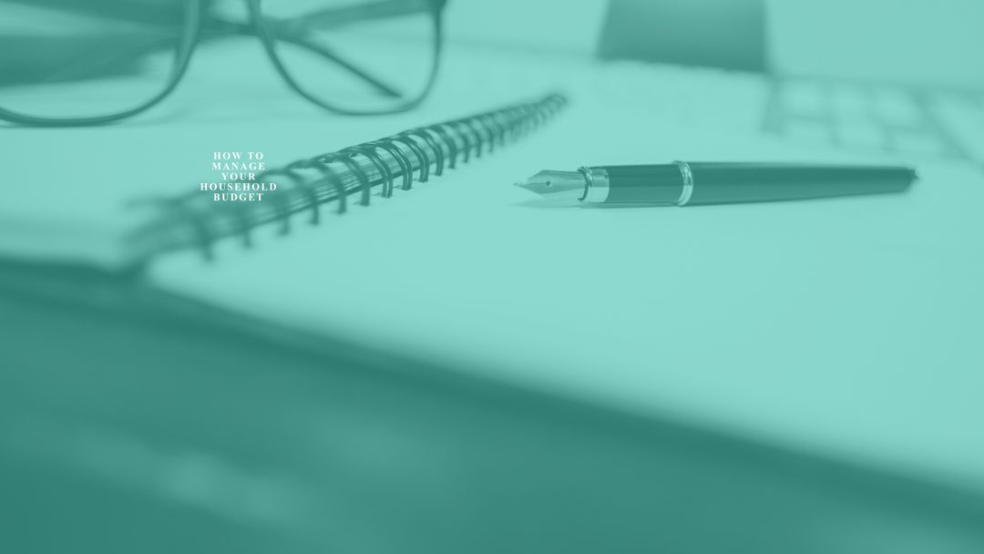 Notebook and pen on desk symbolizing household budgeting