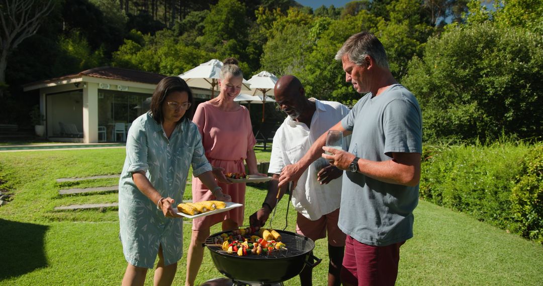 Diverse Friends Enjoying Barbecue in Backyard Setting