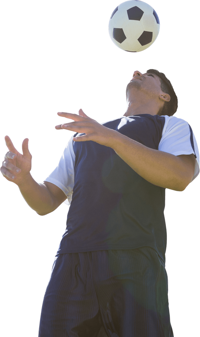 Caucasian Footballer Balancing Soccer Ball on Transparent Background