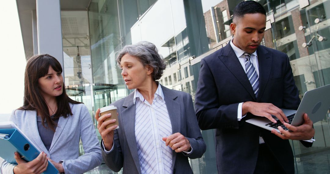 Professional Team Walking and Discussing in Modern Office