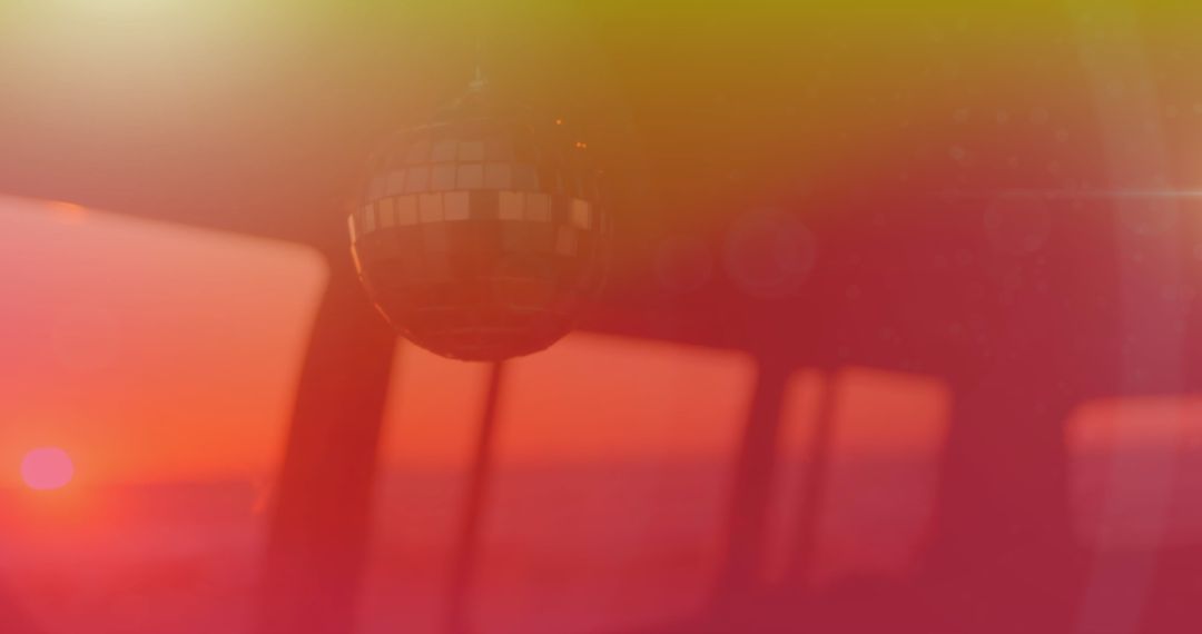 Mirror Ball Reflecting Vibrant Sunset Colors in Vehicle Interior