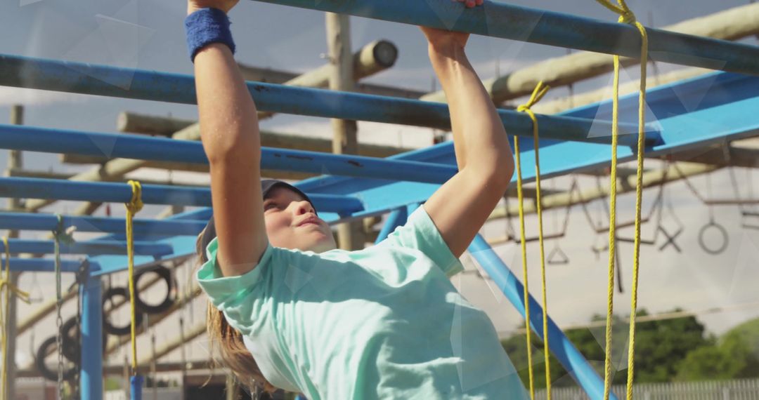 Energetic Boy Navigating Monkey Bars in Outdoor Adventure Park