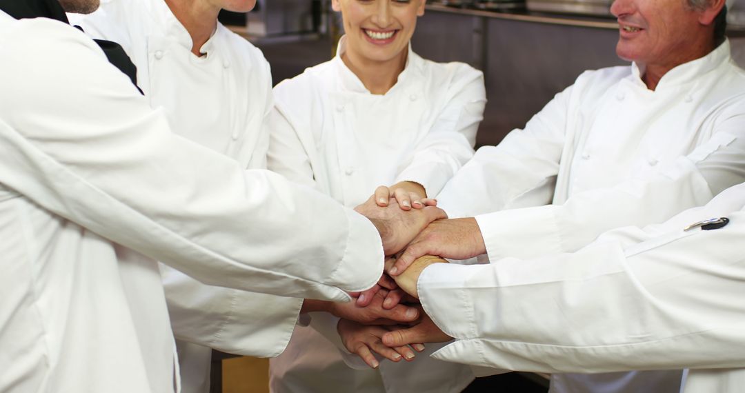 Team of Professional Chefs in Kitchen Huddle - Free Images, Stock Photos and Pictures on Pikwizard.com