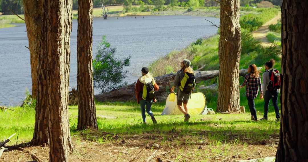 Group of Friends Camping by Lakeside among Trees - Free Images, Stock Photos and Pictures on Pikwizard.com