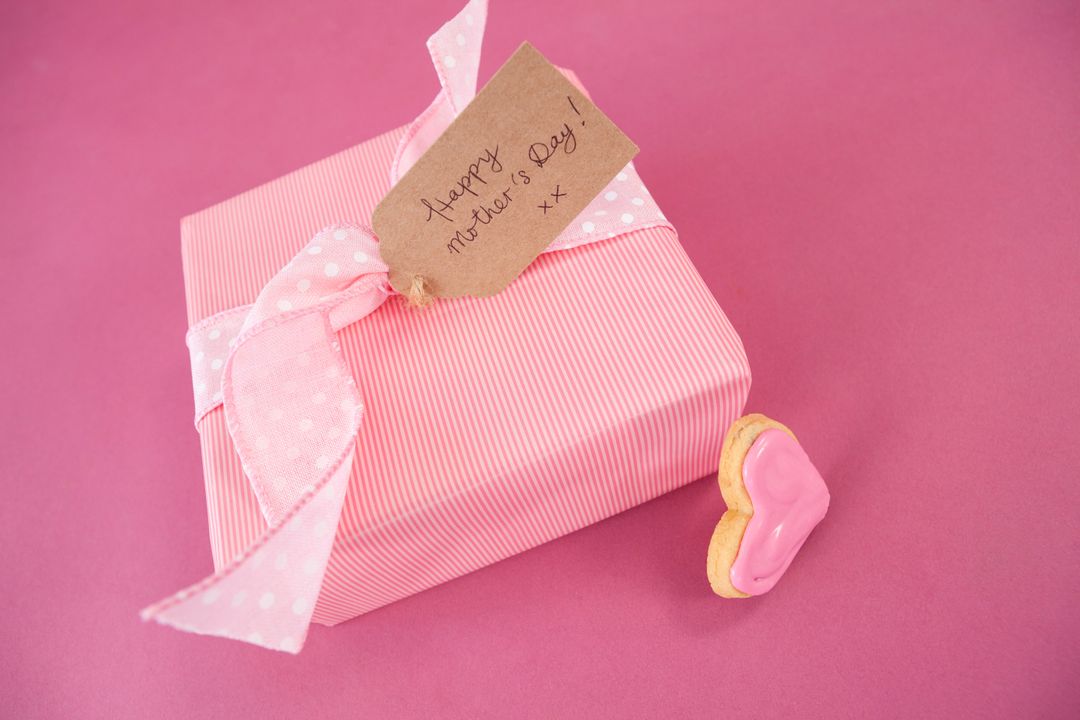 Mother's Day Gift Box with Heart Cookie on Pink Background - Free Images, Stock Photos and Pictures on Pikwizard.com