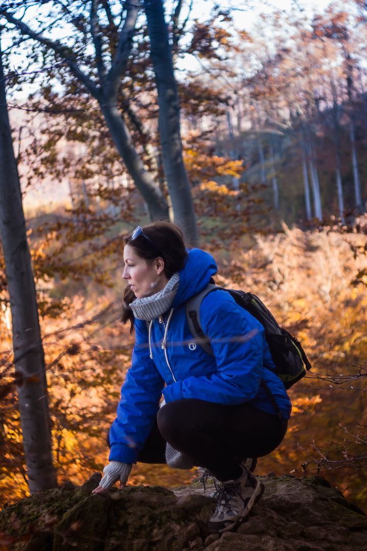 Woman Hiking in Forest Wearing Blue Jacket and Backpack - Free Images, Stock Photos and Pictures on Pikwizard.com