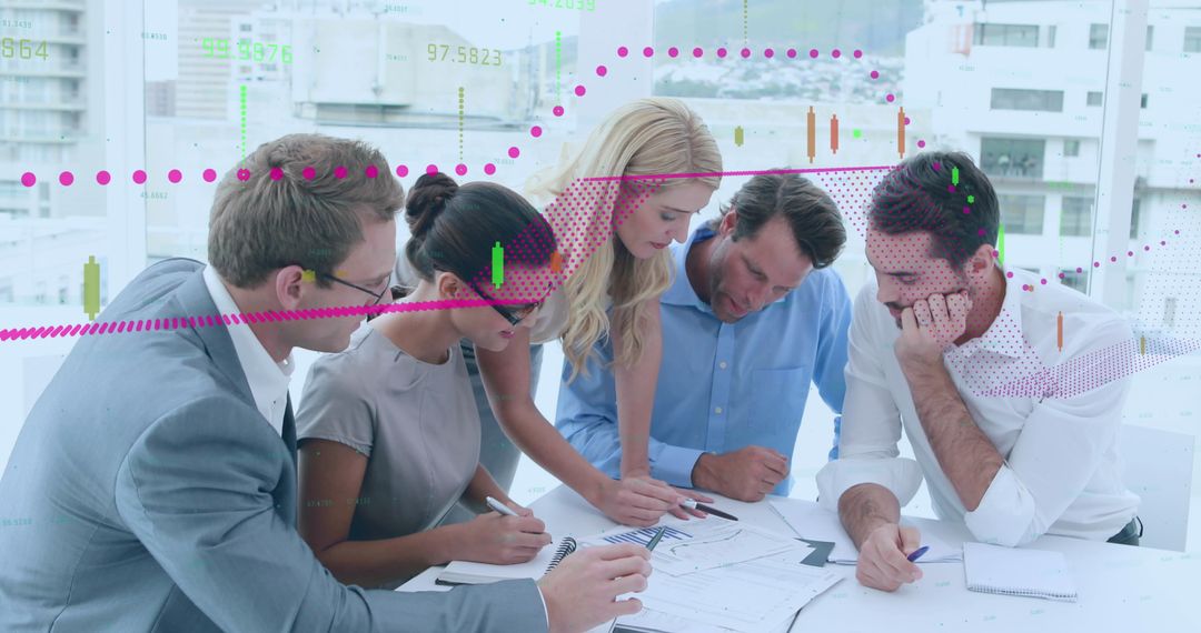 Diverse Business Team Analyzing Financial Charts in Modern Office
