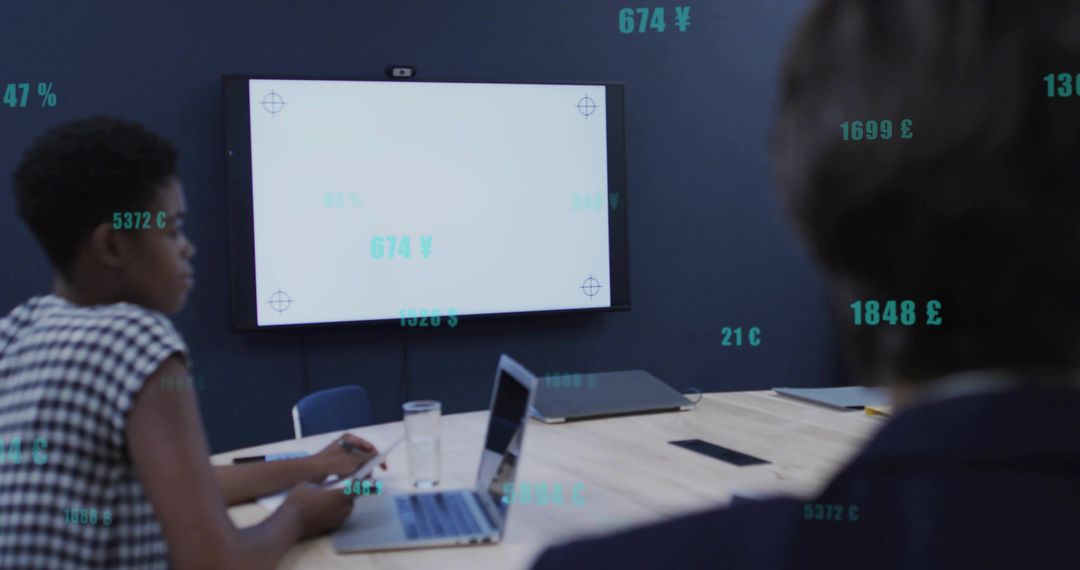 Business Team Analyzing Data on Screen in Modern Office Setting