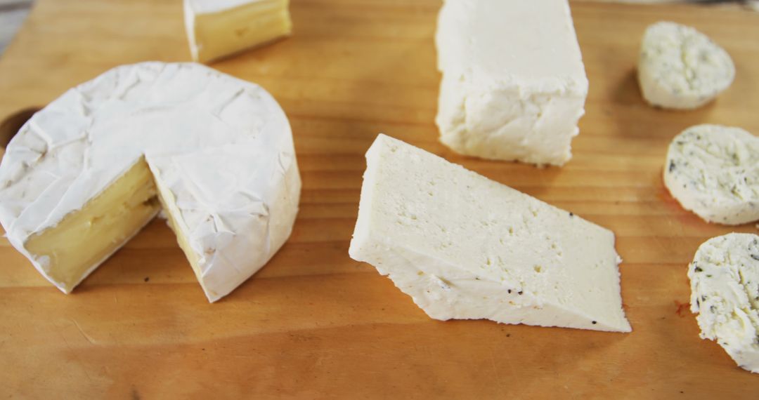 Assorted Artisan Cheeses on Wooden Cutting Board - Free Images, Stock Photos and Pictures on Pikwizard.com