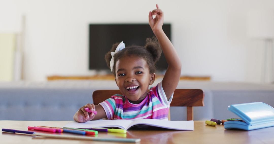 Excited Girl Raising Hand During Online Learning at Home