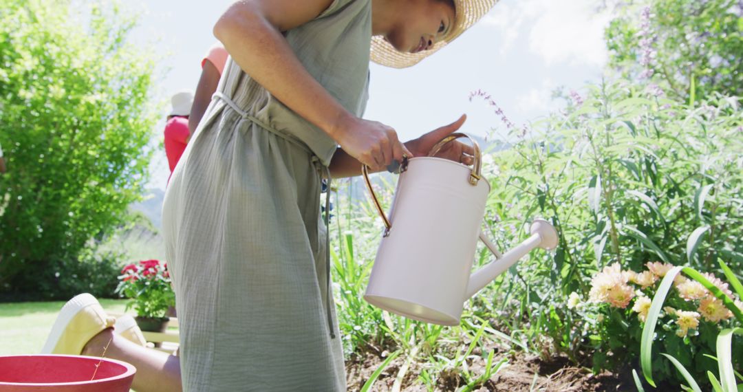 Woman Enjoying Gardening on a Sunny Day - Free Images, Stock Photos and Pictures on Pikwizard.com