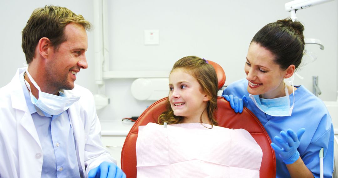 Young Girl Visiting Dentist With Friendly Staff Interaction - Free Images, Stock Photos and Pictures on Pikwizard.com