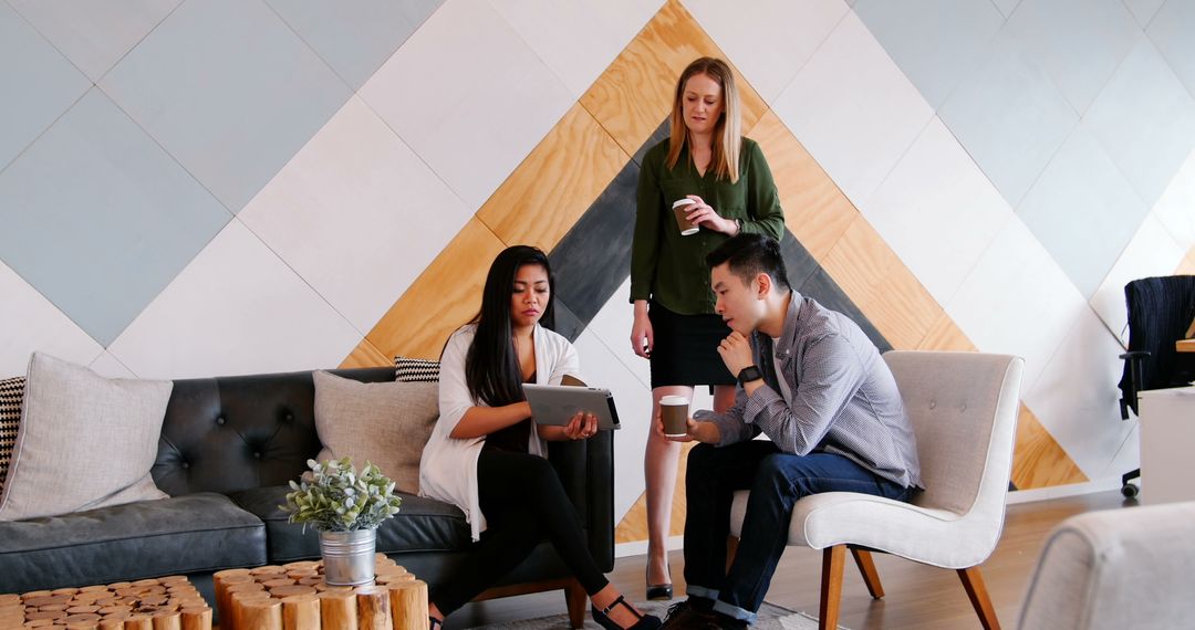 Diverse Group of Colleagues Working on Team Project in Modern Office